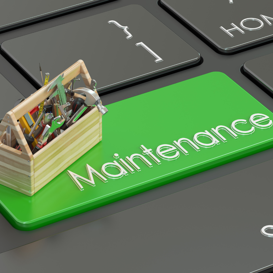 Image d'un clavier de pc portable avec une caisse à outils et une touche verte maintenance 